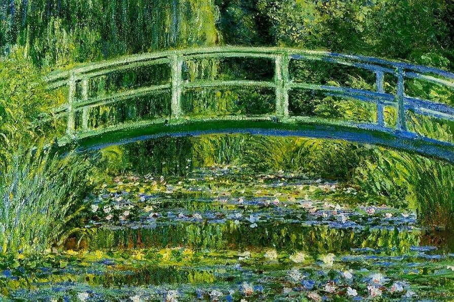 bridge over pond of water lilies